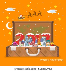 Merry Christmas and Happy New Year 2017 travel. Open suitcase with landmarks. Vector illustration for the website, calendar, ads, banners. Winter landscape. Santa Claus in the sky.