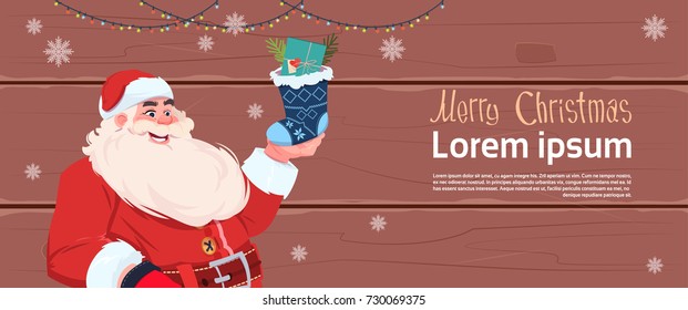 Merry Christmas And Happy New Year Greeting Card With Santa Claus Holding Present Sock Winter Holidays Banner Concept Flat Vector Illustration