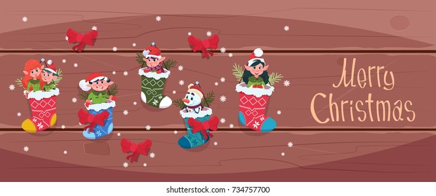 Merry Christmas And Happy New Year Greeting Card Santa Elfs Hanging In Present Socks Winter Holiday Concept Banner Flat Vector Illustration