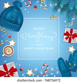 Merry Christmas and Happy New Year Greeting Background. Winter Elements fir branches, knitted blue hat, mittens, coffee cup, gifts, candy cane, sweets, cakes, garlands on blue table Top View Vector