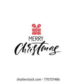 Merry Christmas. Holiday calligraphy phrase with gift. Christmas typography greeting card. Sketch handwritten vector illustration EPS 10 isolated on white background.