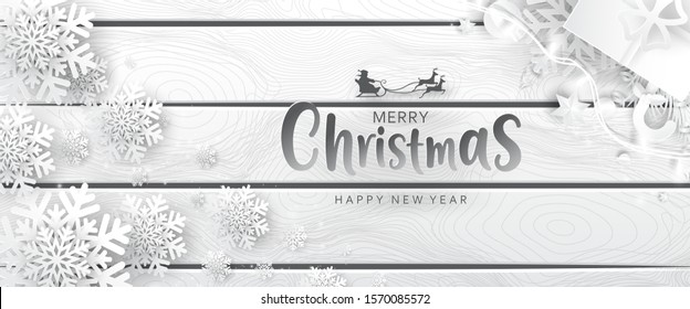 Merry Christmas Horizontal banner with Paper art Christmas tree, ornaments, balls, star and ribbons on Wood background. Great for flyers, posters, headers. Vector illustration.