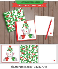 Merry Christmas illustration. Vector printable notepad design of cover and papers with kissing rabbits and mistletoe.