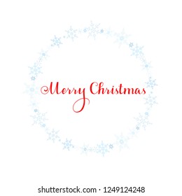Merry Christmas lettering with blue ornaments and wreath decoration of sparkling snowflakes. Merry Christmas calligraphic greeting holiday card.