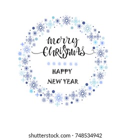 Merry Christmas lettering with blue ornaments and wreath decoration of snowflakes. Merry Christmas  and Happy New Year calligraphic greeting card.