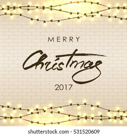 Merry Christmas lettering. Christmas calligraphy. Light bulbs, realistic retro garland, background with yellow glowing lights on white brick wall. Vector illustration.