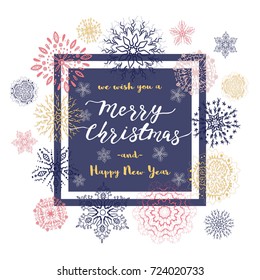 Merry Christmas lettering design with colorful snowflakes on white background. Elegant template for Xmas greeting card.