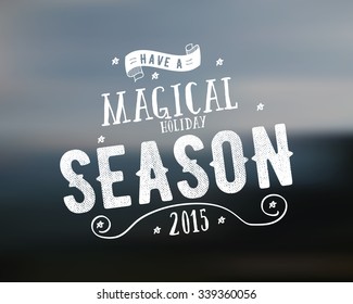 Merry Christmas lettering. Magical season Wishes Vector clipart for Holiday season cards, posters, banners, flyers and photo overlays. Hand drawn typography element. On blurred background