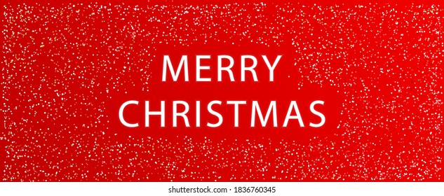 Merry Christmas on a red background with confetti.Merry Christmas holiday red banner. Vector illustration. Merry Christmas Greeting card.Vector Illustration.Horizontal posters, cards, headers,