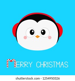 Merry Christmas. Penguin round head face icon. Red headphones hat. Happy New Year. Cute cartoon kawaii baby character. Arctic animal. Flat design. Hello winter. Blue background. Vector illustration
