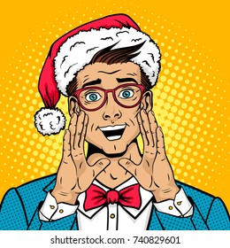 Merry Christmas pop art male face. Surprised happy man in Santa Claus hat, suit, bow tie with open mouth rises hands screaming announcement. Vector illustration in retro comic style. New year poster.