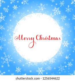 Merry Christmas red lettering with blue ornaments and wreath decoration of sparkling snowflakes. Merry Christmas calligraphic greeting holiday card.