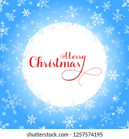 Merry Christmas red lettering with blue ornaments and wreath decoration of sparkling snowflakes. Merry Christmas calligraphic greeting holiday card.