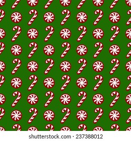 Merry Christmas! Red and white candy canes on green background. Seamless pattern. Vector illustration.