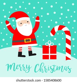 Merry Christmas. Santa Claus Candy cane Gift box on snowdrift. Cute cartoon kawaii funny smiling baby character. Costume, red hat, golden belt. New Year. Greeting card. Blue snow background. Vector