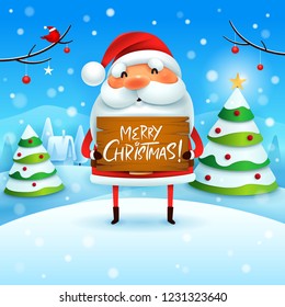 Merry Christmas! Santa Claus holds wooden board sign in Christmas snow scene winter landscape. 