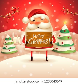 Merry Christmas! Santa Claus holds wooden board sign in Christmas snow scene winter landscape.