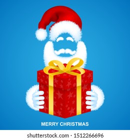 Merry Christmas. Santa Claus in a red fur hat with a gift in his hands.