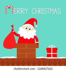 Merry Christmas. Santa Claus in the roof chimney holding bag. Red hat, costume, beard, gift box. Cute cartoon kawaii funny character. Happy New Year. Blue background. Flat design. Vector illustration