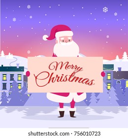 Merry Christmas from Santa on city background. He holds poster with congratulation among white snowy field. Big snowflakes fall on houses. Buildings are with switched light on vector illustration