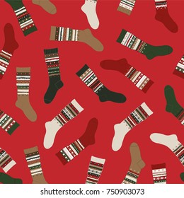 Merry Christmas Seamless Pattern with knitted socks on a red background.
