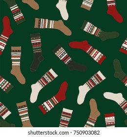 Merry Christmas Seamless Pattern with knitted socks on a Green background.