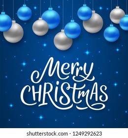 Merry Christmas seasons greetings text on blue background with sparkles and colorful hanging balls. Vector illustration for holidays with lettering