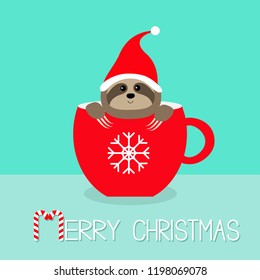 Merry Christmas. Sloth sitting in red coffee cup teacup. Santa hat. Face and hands. Cute cartoon character. Hello winter. Snowflake. Wild baby animal. Slow down. Blue background. Flat design. Vector