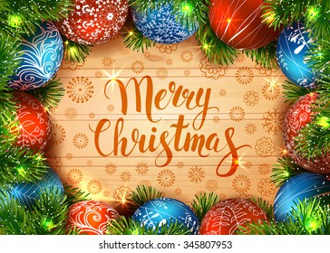 Merry Christmas. Template vector card. Calligraphy. Lettering. Fir tree with blue and red balls on the wood table. Shiny  garland. 