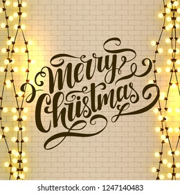 Merry Christmas vector lettering. Christmas calligraphy. Light bulbs, realistic retro garland, background with yellow glowing lights on white brick wall. Hand drawn clipart. Xmas design template.