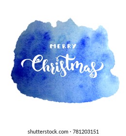 Merry Christmas Vector Lettering isolated on blue abstract watercolor background.