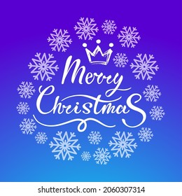 Merry Christmas white hand drawn calligraphic lettering with crown surrounded with snowflakes in a circle shape as a template for greeting cards and social media posts. On bright blue background.