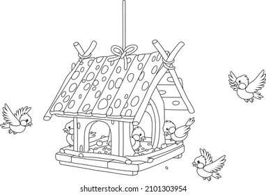 Merry small sparrows and titmice flying around a fancy birdfeeder hanging on a branch, black and white outline vector cartoon illustration for a coloring book page