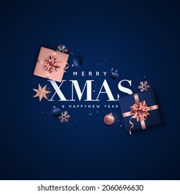 Merry Xmas and Happy New Year. Background Christmas design of rose gold and blue balls, gift boxes, star, snowflakes. Flat lay top view. Christmas greeting cards, web sites, social media.