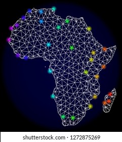 Mesh vector map of Africa with glare effect. Light spots have bright spectrum colors. Abstract lines, triangles, light spots and points on a dark background with map of Africa.