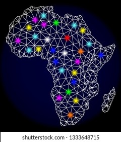 Mesh vector map of Africa with glare effect on a dark background. Abstract lines, triangles, light colorful spots and points forms map of Africa.