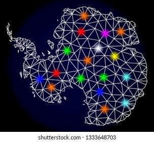 Mesh vector map of Antarctica with glare effect on a dark background. Abstract lines, triangles, light colorful spots and points forms map of Antarctica.