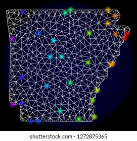 Mesh vector map of Arkansas State with glare effect. Light spots have bright spectrum colors. Abstract lines, triangles, light spots and points on a dark background with map of Arkansas State.