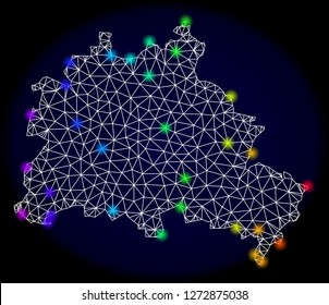 Mesh vector map of Berlin City with glare effect. Light spots have bright spectrum colors. Abstract lines, triangles, light spots and points on a dark background with map of Berlin City.