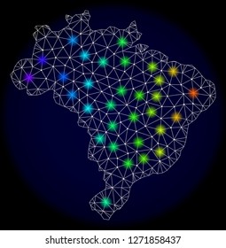 Mesh vector map of Brazil with glare effect. Light spots have bright spectrum colors. Abstract lines, triangles, light spots and points on a dark background with map of Brazil.