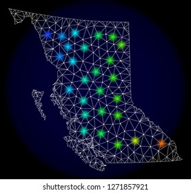 Mesh vector map of British Columbia with glare effect. Light spots have bright spectrum colors. Abstract lines, triangles, light spots and points on a dark background with map of British Columbia.