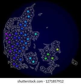 Mesh vector map of Denmark with glare effect. Light spots have bright spectrum colors. Abstract lines, triangles, light spots and points on a dark background with map of Denmark.