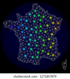 Mesh vector map of France with glare effect. Light spots have bright spectrum colors. Abstract lines, triangles, light spots and points on a dark background with map of France.