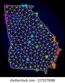 Mesh vector map of Georgia State with glare effect. Light spots have bright rainbow colors. Abstract lines, triangles, light spots and points on a dark background with map of Georgia State.