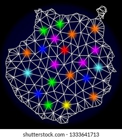 Mesh vector map of Gran Canaria with glare effect on a dark background. Abstract lines, triangles, light colorful spots and points forms map of Gran Canaria.