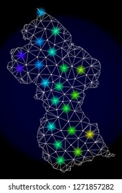 Mesh vector map of Guyana with glare effect. Light spots have bright spectrum colors. Abstract lines, triangles, light spots and points on a dark background with map of Guyana.