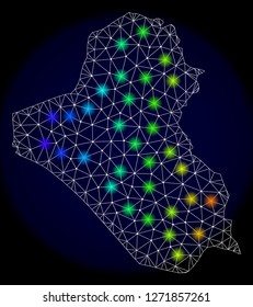 Mesh vector map of Iraq with glare effect. Light spots have bright spectrum colors. Abstract lines, triangles, light spots and points on a dark background with map of Iraq.