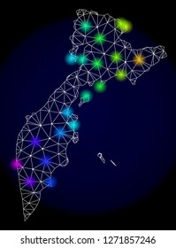 Mesh vector map of Kamchatka with glare effect. Light spots have bright spectrum colors. Abstract lines, triangles, light spots and points on a dark background with map of Kamchatka.