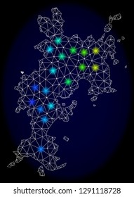 Mesh vector map of Komodo Island with glare effect on a dark background. Light spots have bright rainbow colors. Abstract lines, triangles, light spots and points forms map of Komodo Island.