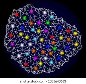 Mesh vector map of La Gomera Island with glare effect on a dark background. Abstract lines, triangles, light colorful spots and points forms map of La Gomera Island.